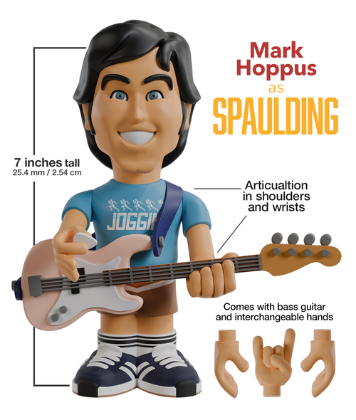 Mark Hoppus “Spaulding” 7-inch vinyl figure holding a bass guitar against a white background, with extra detachable hands in the bottom-right corner